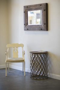 White chair beside a side table